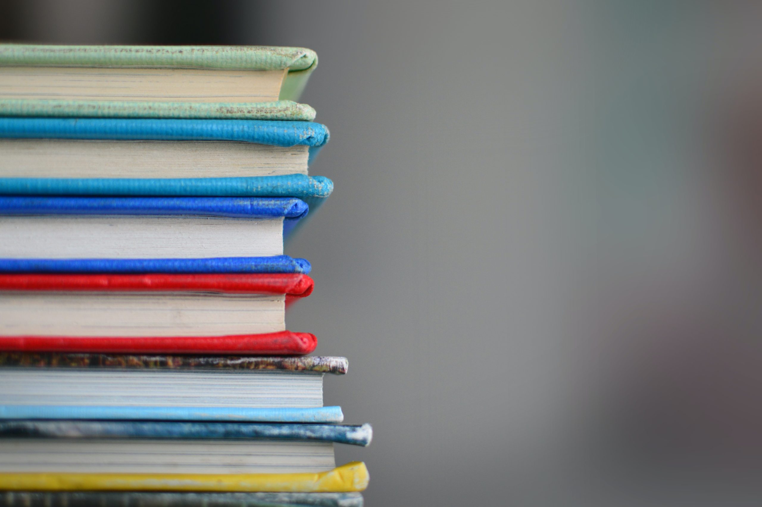 Photo of books stacked on top of each other